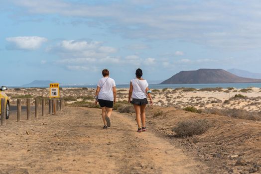 Corralejo, Fuerteventura, Spain: 2020 October 30: People walk  in the Dunas de Corralejo Natural Park in Fuerteventura, Spain in the fall of 2020.
