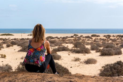 Corralejo, Fuerteventura, Spain: 2020 October 30: Young woman  in the Dunas de Corralejo Natural Park in Fuerteventura, Spain in the fall of 2020.