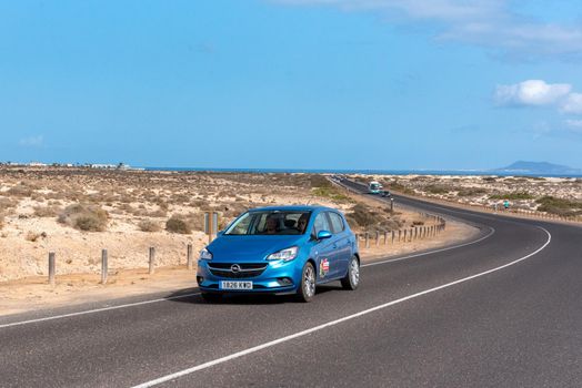 Corralejo, Fuerteventura, Spain: 2020 October 30: Rental car in the Dunas de Corralejo Natural Park in Fuerteventura, Spain in the fall of 2020.