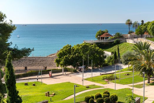 Tarragona, Spain : 2020 September 27: Sunny day in Tarragona Amphitheatre in Spain - A UNESCO World Heritage Site in summer.