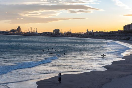 Tarragona, Spain: September 27, 2020: People surfing in the Plaza del Anfiteatro in Tarragona in the summer of 2020.