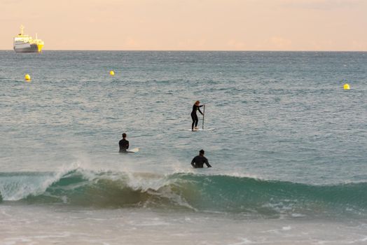 Tarragona, Spain: September 27, 2020: People surfing in the Plaza del Anfiteatro in Tarragona in the summer of 2020.