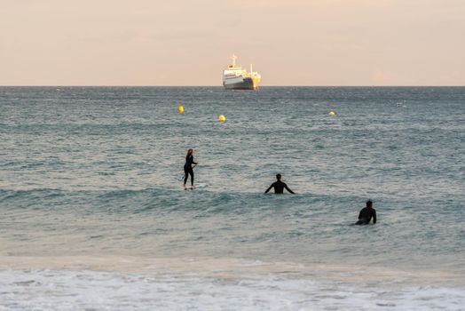 Tarragona, Spain: September 27, 2020: People surfing in the Plaza del Anfiteatro in Tarragona in the summer of 2020.