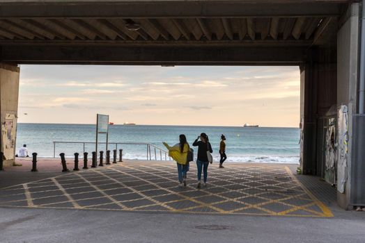 Tarragona, Spain : 2020 September 27: People walking in El Milacre Beach in Tarragona in the summer of 2020.
