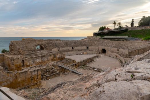 Sunny day in Tarragona Amphitheatre in Spain - A UNESCO World Heritage Site in summer.