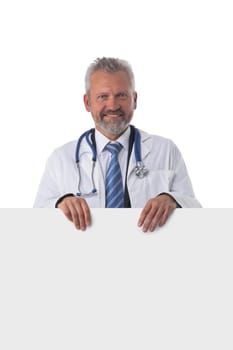 Portrait of a mature caucasian male doctor nurse with blank banner isolated on white background