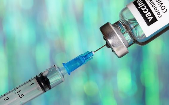 Coronavirus 2019-nCoV vaccine with syringe close up, medical concept, vaccination, injection,Disease prevention, immunization.