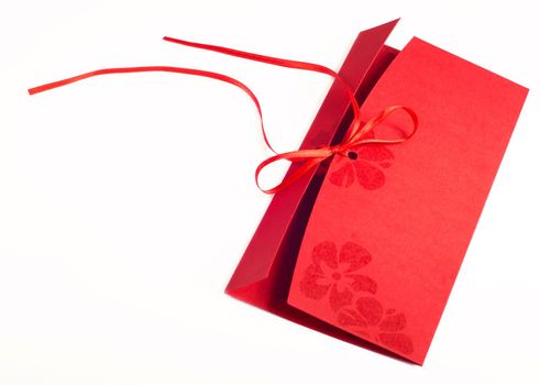Red envelope made from natural fiber paper on white background