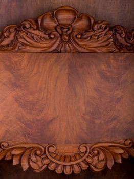 Old wooden table on black background with thread