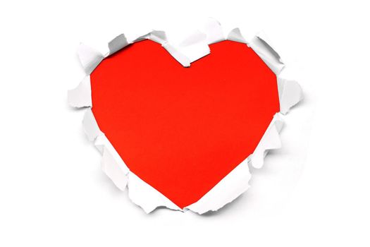 Close up of a ripped paper hole red heart shaped on white background copy space