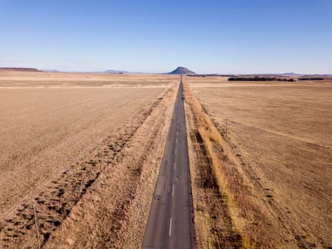 Open road in a grassy landscape