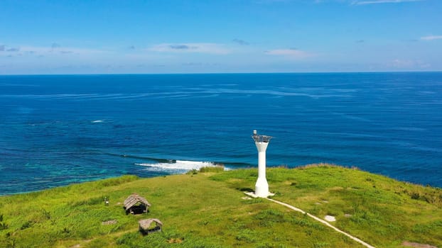 Basot Island, Caramoan, Camarines Sur, Philippines. Lighthouse on a tropical island. Beautiful landscape with a green island. Summer and travel vacation concept.