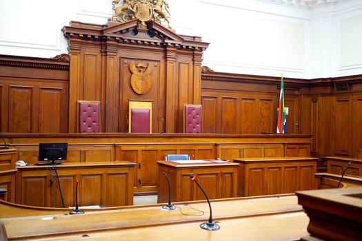 Empty courtroom, with old wooden panelling