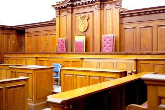 Empty courtroom, with old wooden paneling