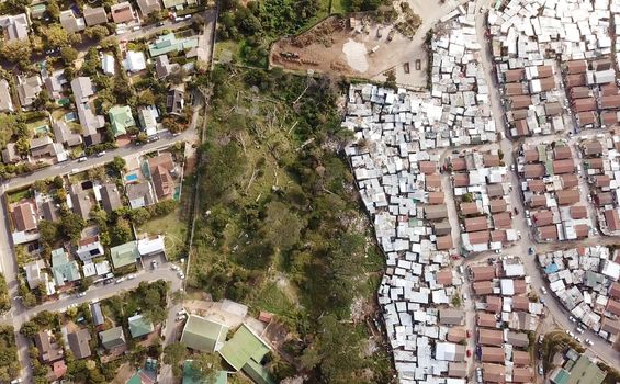 Aerial view over a township and wealthy suburb in South Africa