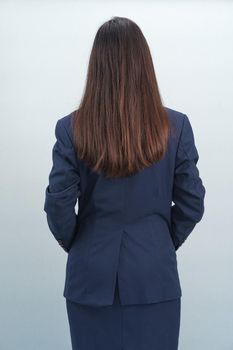 Asian women wearing a suit in studio from behind