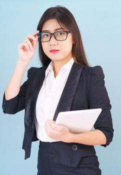 Young women standing in suit holding her digital tablet computor