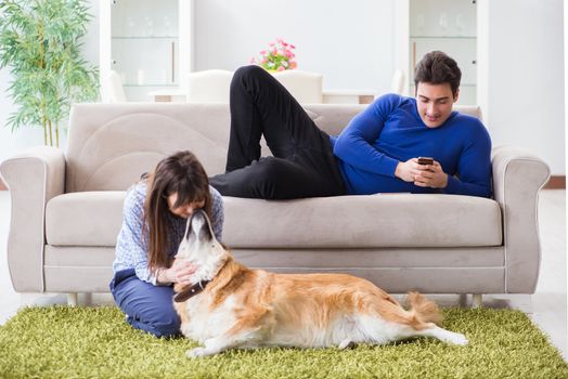 Happy family with golden retriever dog