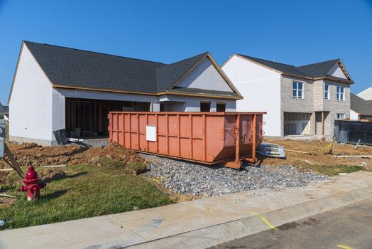 Horizontal shot of a neighborhood of new homes under construction.