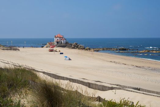 Beautiful chapel on the beach Capela do Senhor da Pedra in Miramar, in Portugal