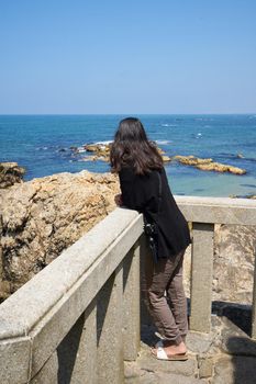 Woman in Praia do Senhor da Pedra beach, in Miramar Arcozelo, Portugal