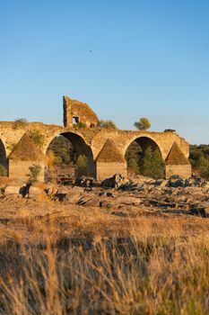 Destroyed abandoned Ajuda bridge crossing the Guadiana river between Spain and Portugal