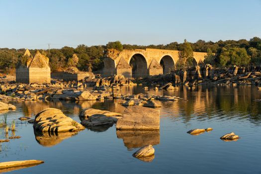 Destroyed abandoned Ajuda bridge crossing the Guadiana river between Spain and Portugal