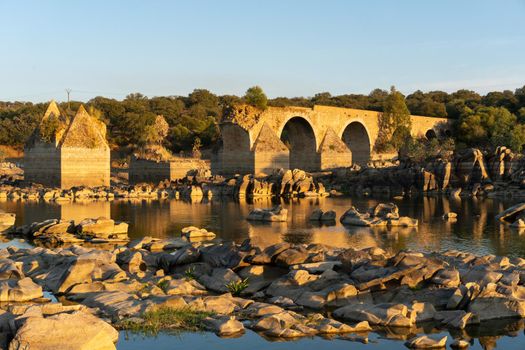 Destroyed abandoned Ajuda bridge crossing the Guadiana river between Spain and Portugal