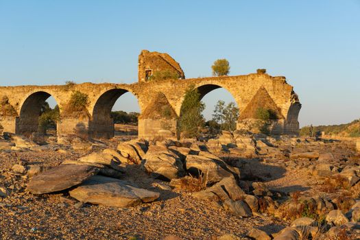 Destroyed abandoned Ajuda bridge crossing the Guadiana river between Spain and Portugal