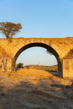 Destroyed abandoned Ajuda bridge crossing the Guadiana river between Spain and Portugal