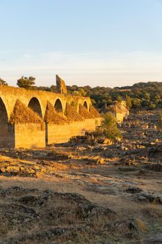 Destroyed abandoned Ajuda bridge crossing the Guadiana river between Spain and Portugal