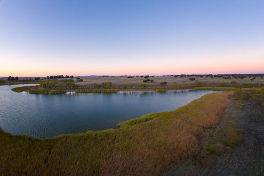 Lake drone aerial view at sunset in Alentejo, Portugal