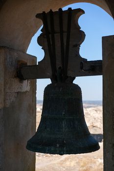 View of Juromenha castle window and bell in Alentejo landscape in Portugal