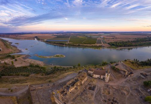 Juromenha castle, village and Guadiana river drone aerial view at sunset in Alentejo, Portugal and Spain on the background