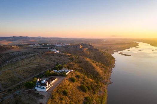 Juromenha castle, village and Guadiana river drone aerial view at sunrise in Alentejo, Portugal