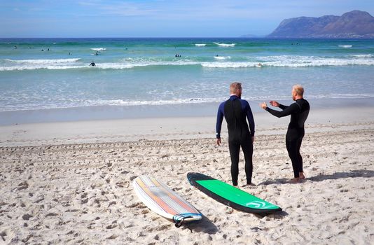 MUIZENBERG BEACH, CAPE TOWN, SOUTH AFRICA - 9 March 2018 : Muizenberg beach is a common morning surf spot for Capetonians.