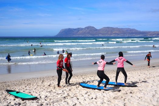 MUIZENBERG BEACH, CAPE TOWN, SOUTH AFRICA - 9 March 2018 : Surf school at Muizenberg beach, Cape Town