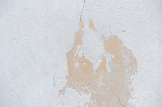 A wall with a peeling surface and roughness close-up.Texture or background
