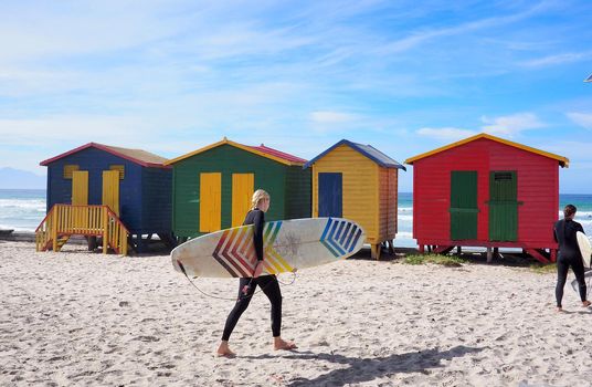 MUIZENBERG BEACH, CAPE TOWN, SOUTH AFRICA - 9 March 2018 : Muizenberg beach is a common morning surf spot for Capetonians.