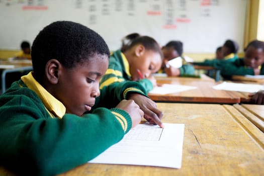 Young boy in a poor school in South Africa