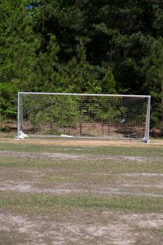 Unprotected soccer goal on an empty soccer field