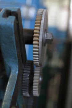 Close up of a set of grinding gears in a metal workshop