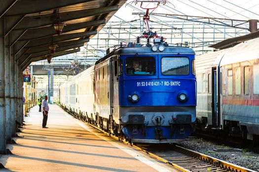 Detail of train in motion at train platform at Bucharest North Railway Station (Gara de Nord Bucharest) in Bucharest, Romania, 2020