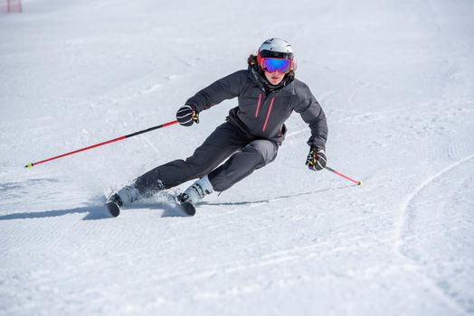 Grau Roig, Andorra : 2021 January 28 : Young  woman skiing on a sunny day in Andorra.