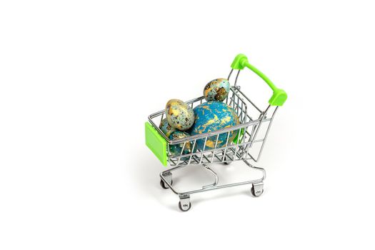 .Basket with colored Easter eggs isolated on a white background