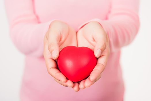 Love Valentine's Day. Woman beauty hands holding red heart for giving help donation medical healthcare concept isolated on white background, holiday background concept