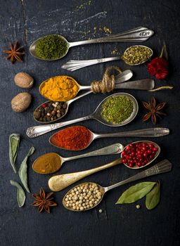 Various spices spoons on table. Top view with copy space