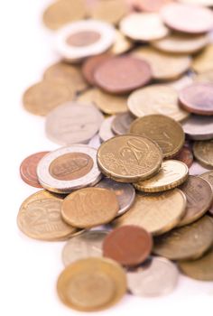 Coins of different countries on a white background