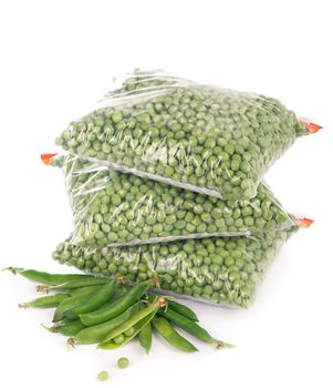 Composition with organic frozen vegetables on white background. Green peas in the package