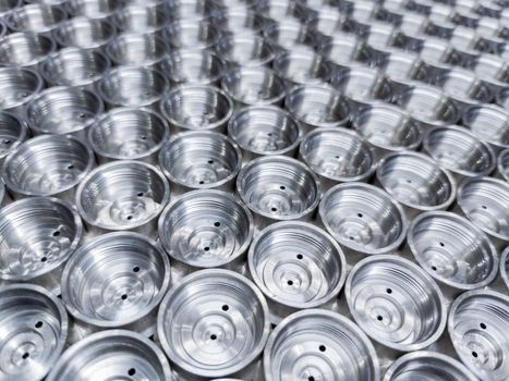 abstract industrial close-up background of shiny steel turned parts.